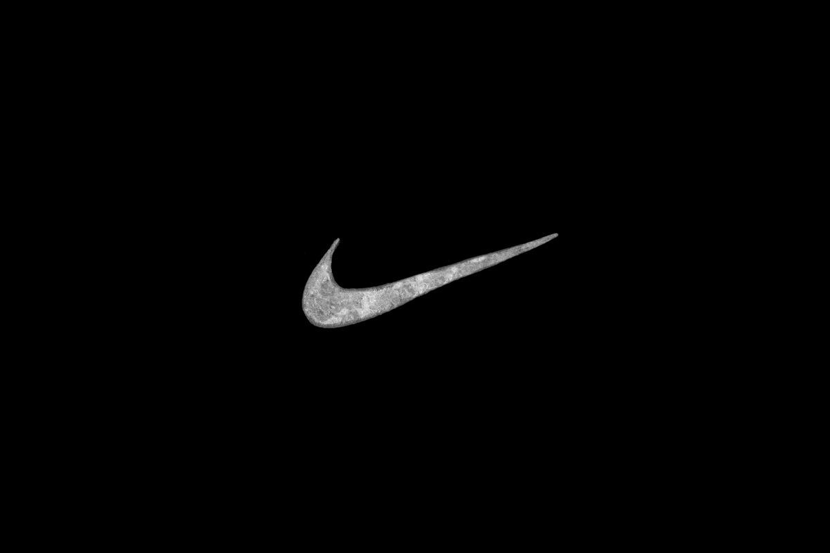 Hand-drawn Nike logo — artisanal graphic design by BMD Design for Nike Graphic Studio apparel collections, custom Swoosh illustration